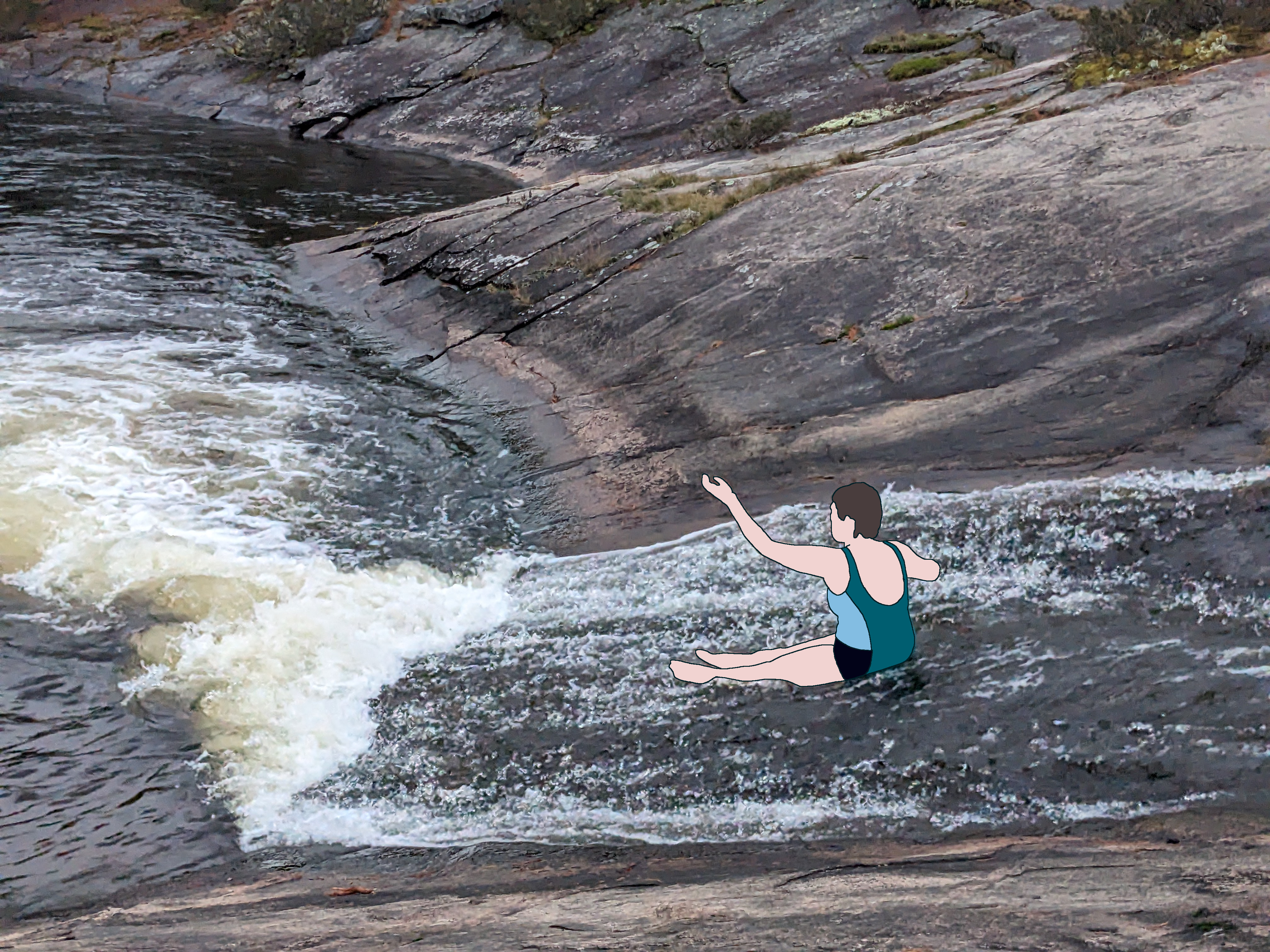 Someone going down the natural waterslide.