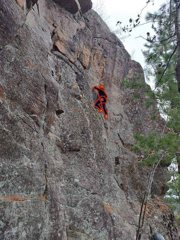 Someone climbing the cliff.