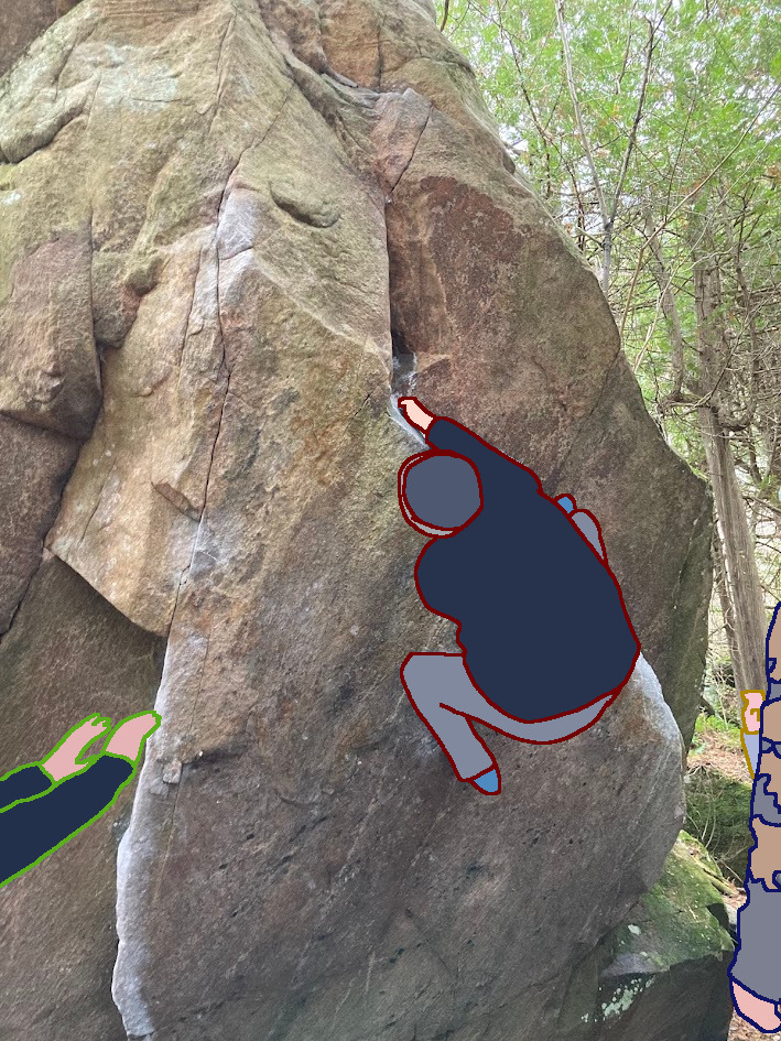 Mark Climbing a boulder with some spotters.